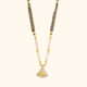 Antique Mangalsutra Features Pink Stones And a Pendant.